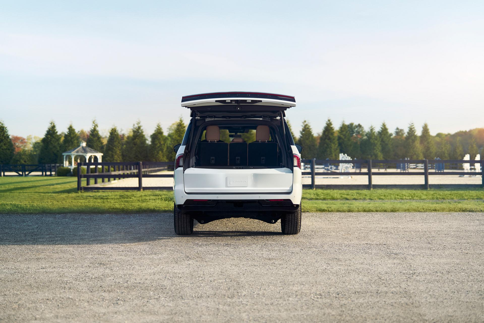 A straight on rear shot of a 2026 Lincoln Navigator® with the Lincoln Split Gate open shows how much can fit in the cargo area