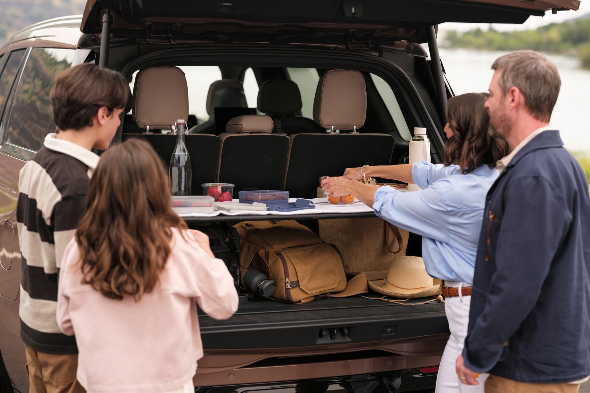 The back of a 2026 Lincoln Navigator® opens the Lincoln Split Gate, showcasing the spacious cargo area