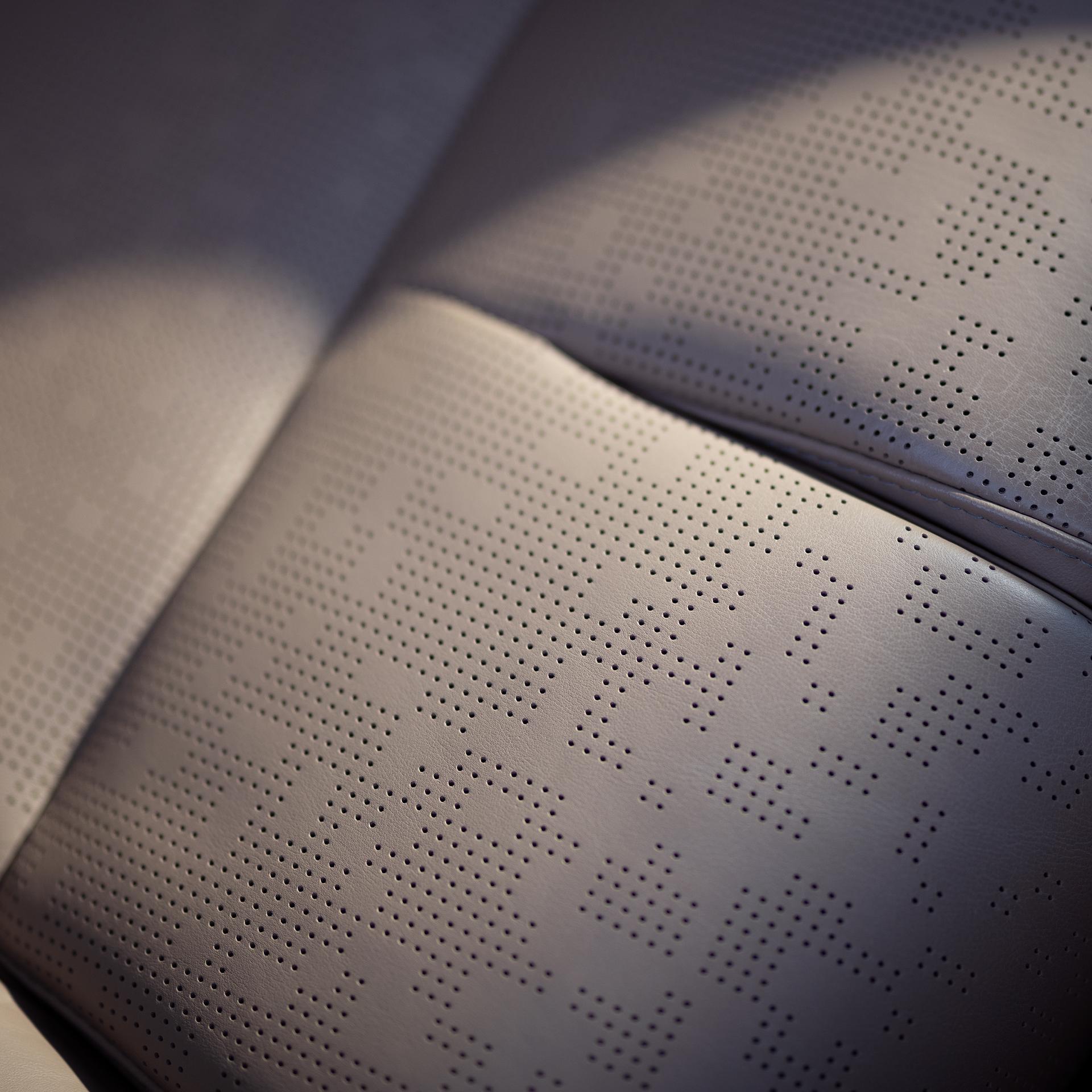 Gros plan sur le siège à motif perforé d’un Lincoln Navigator® Black Label™ 2027 avec la thématique Enlighten