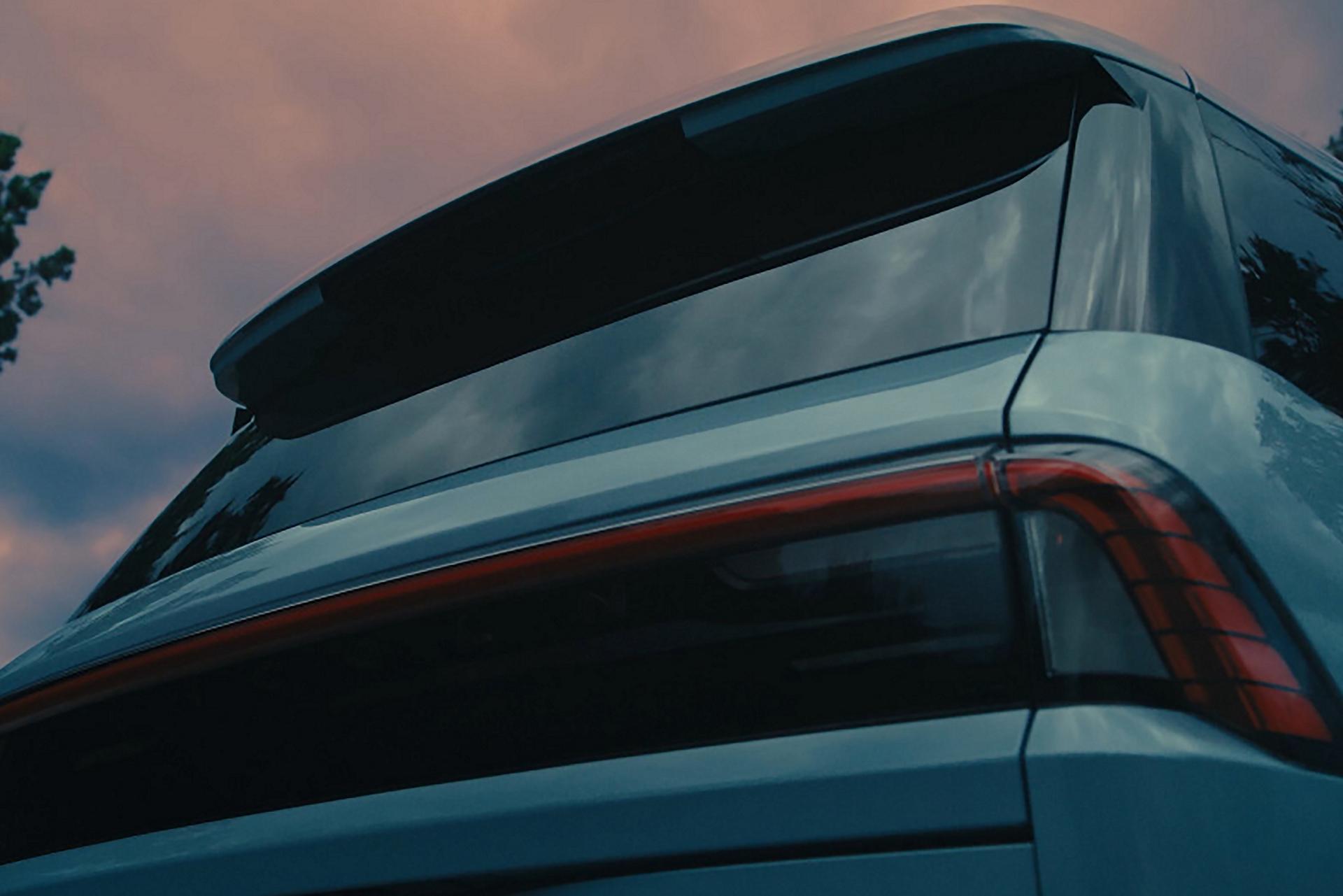 The back of a 2026 Lincoln Navigator® opens the Lincoln Split Gate, showcasing the spacious cargo area